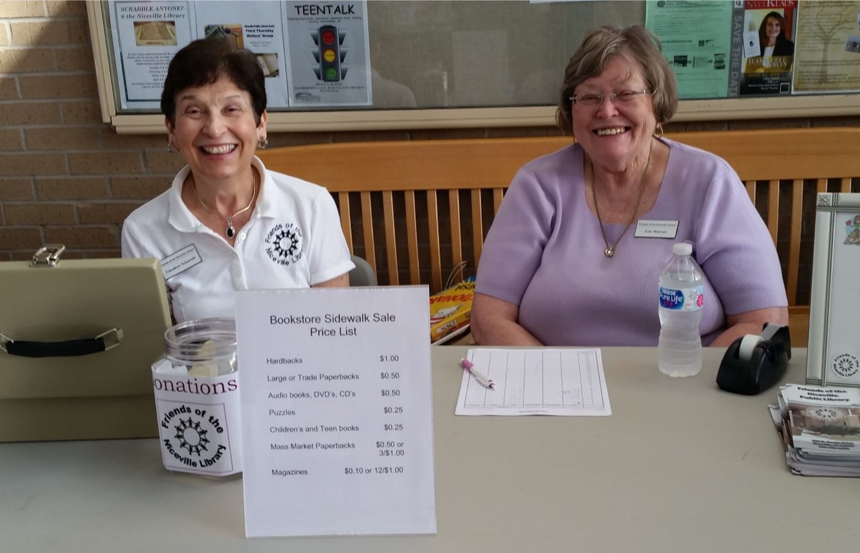 Two Friends volunteer at the Sidewalk Sale